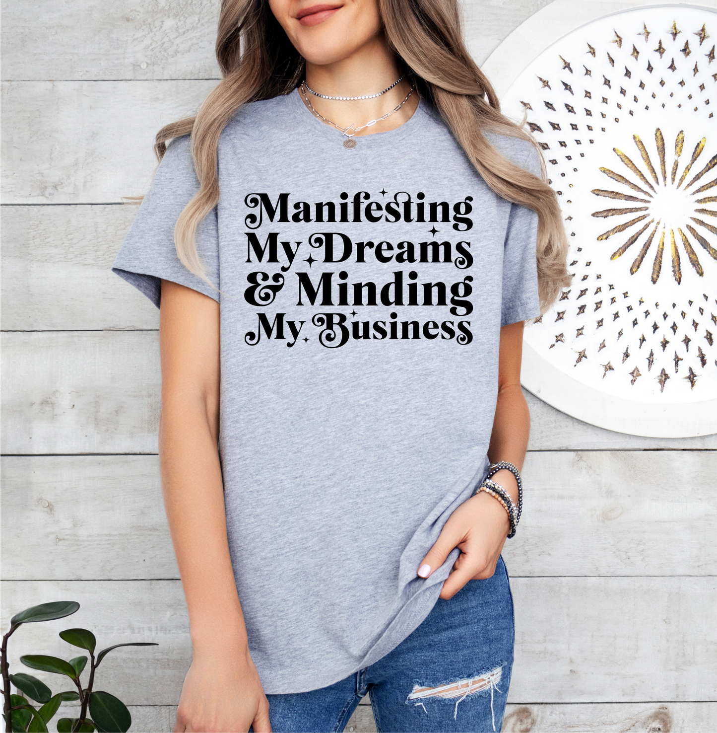 a woman wearing a t - shirt that says, manning, my dreams, and