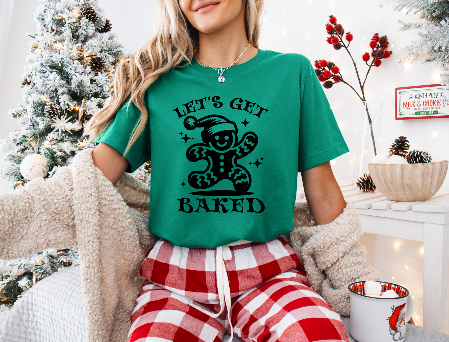 a woman sitting on a couch wearing a green shirt
