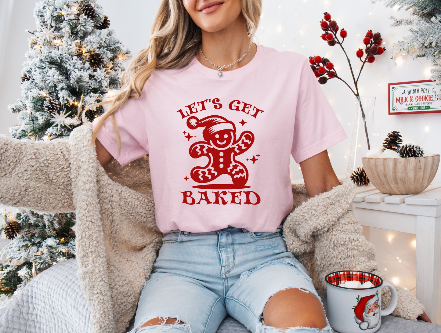 a woman sitting on a couch wearing a t - shirt that says let's
