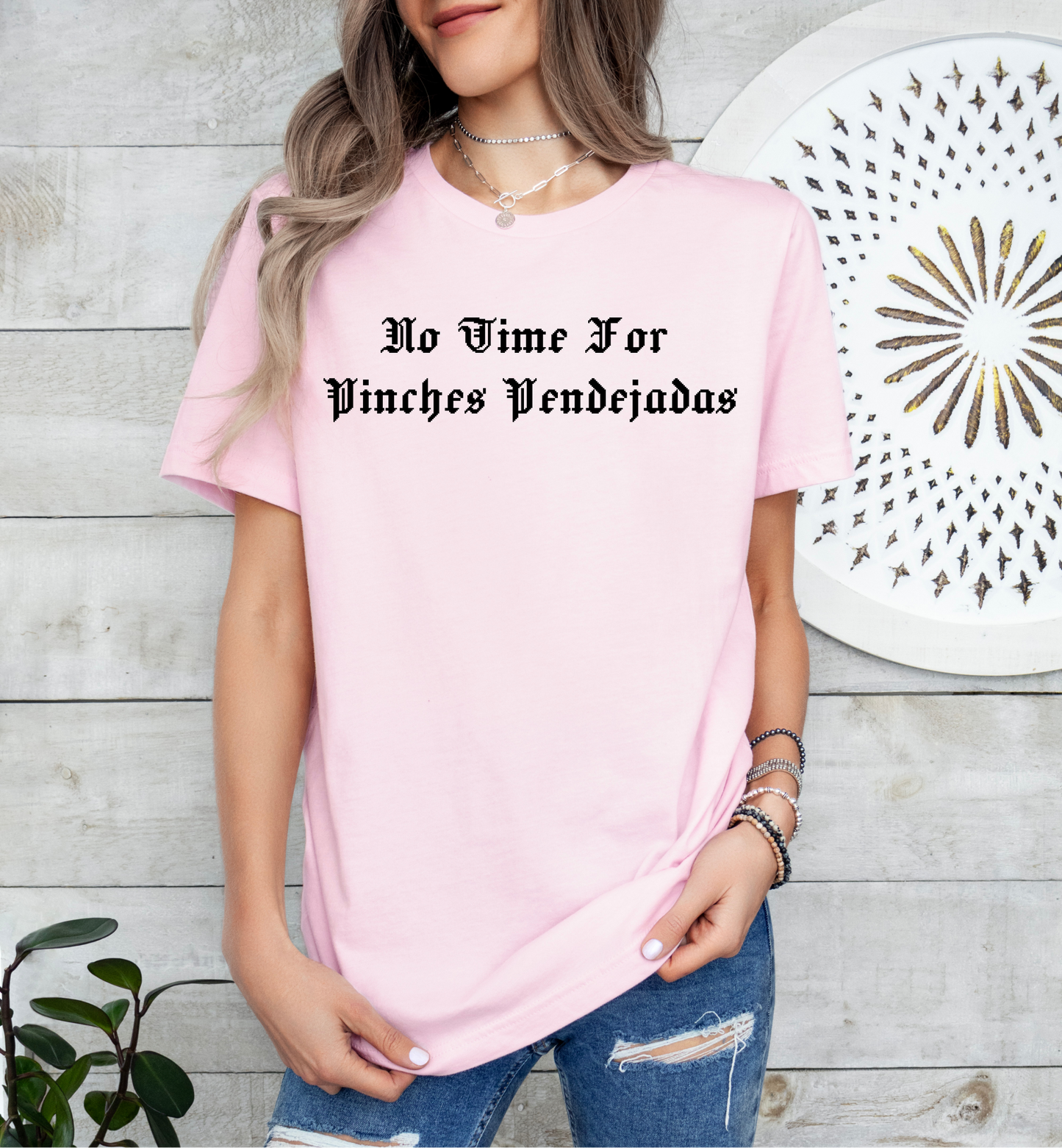 a woman wearing a pink t - shirt that says no wine for unicorns wednesday