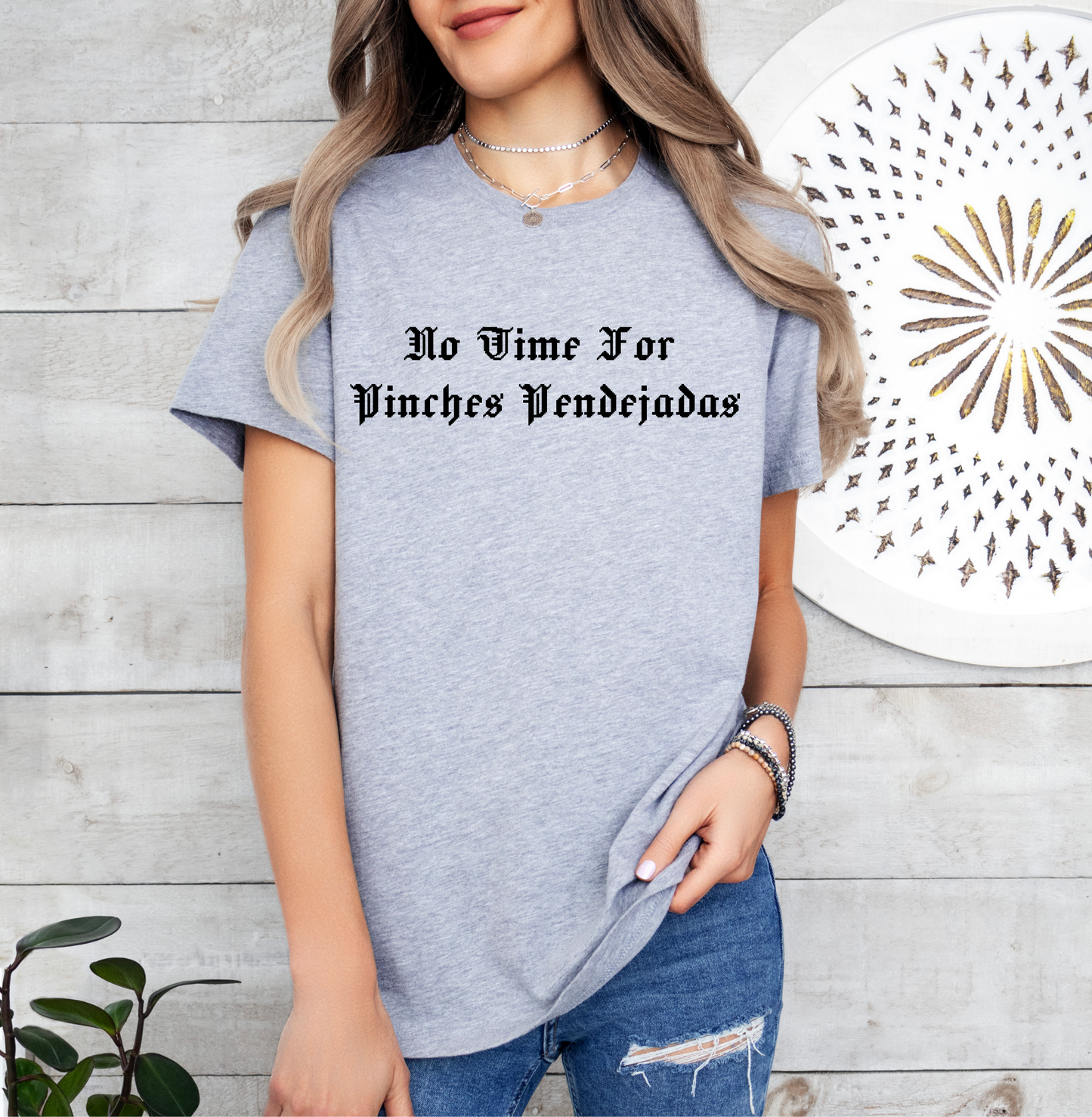 a woman wearing a t - shirt that says no wine for unicorns vending
