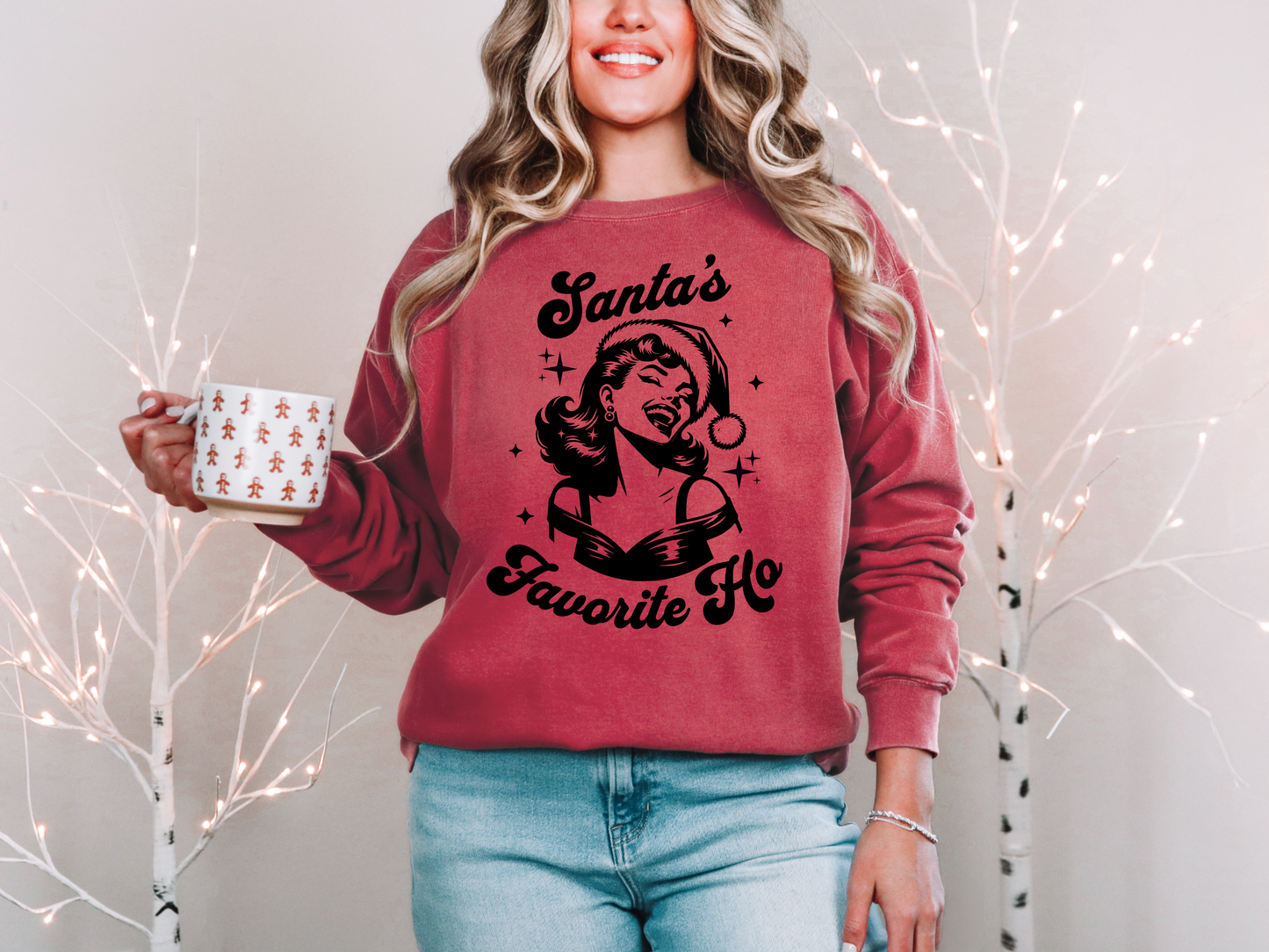 a woman wearing a santa's favorite ugly sweater holding a coffee mug