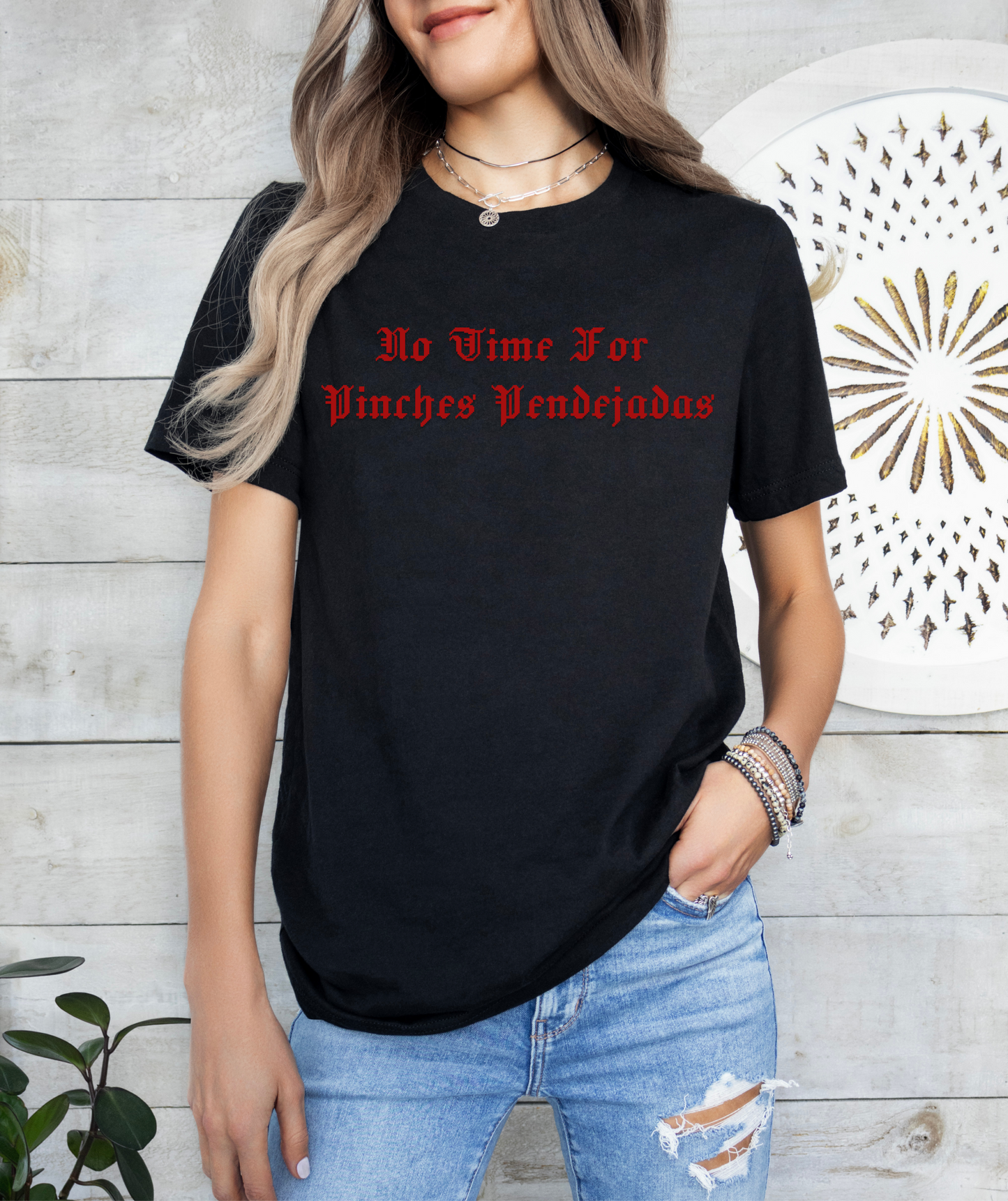 a woman wearing a black t - shirt with red lettering