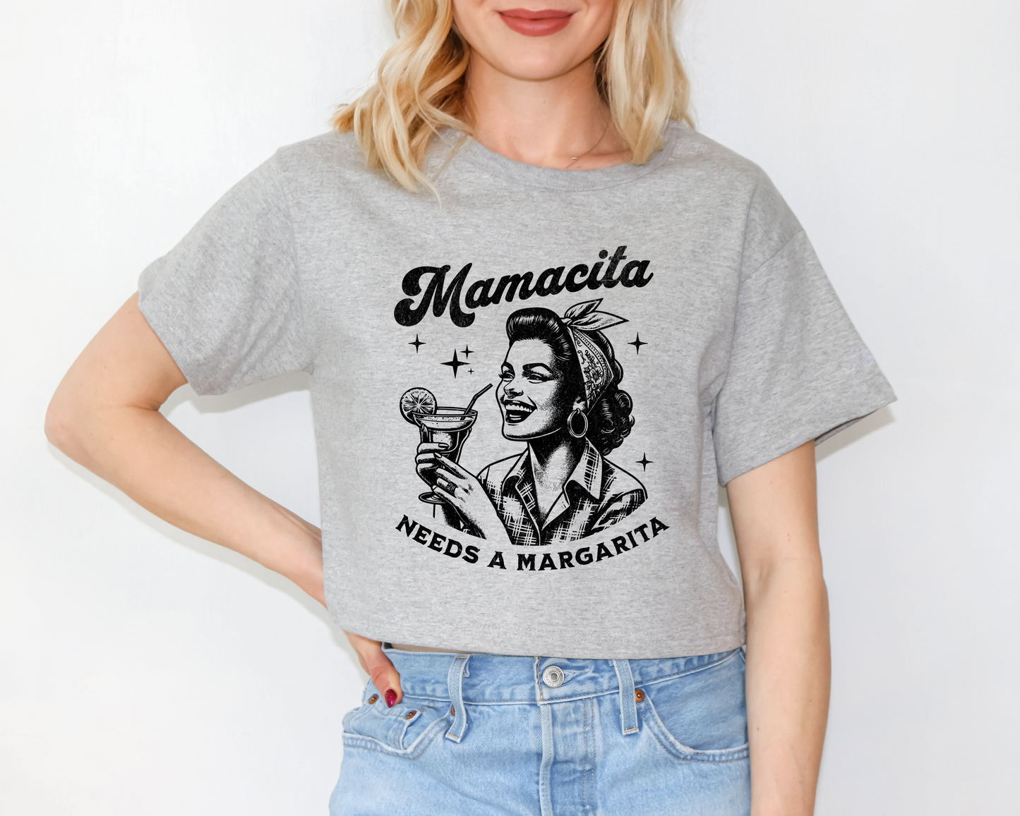 a woman wearing a gray shirt with a picture of a woman holding a martini