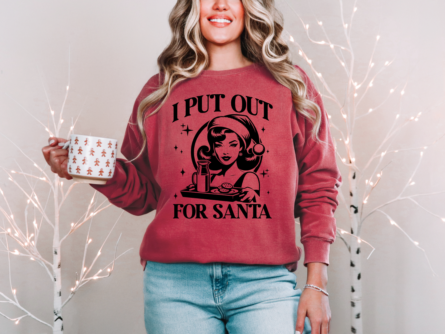 a woman in a red sweater holding a coffee mug