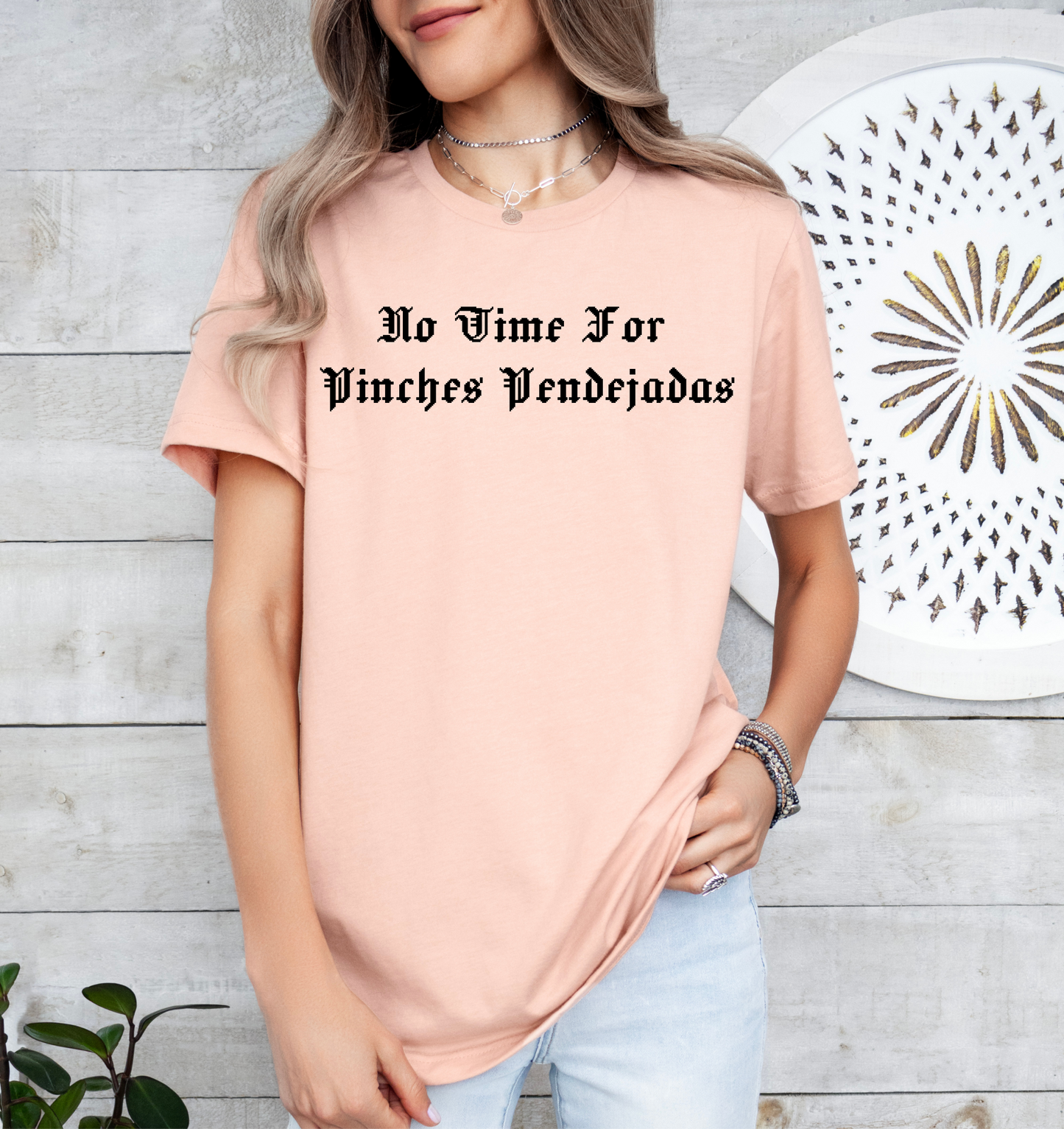 a woman wearing a pink t - shirt that says, no wine for princesses