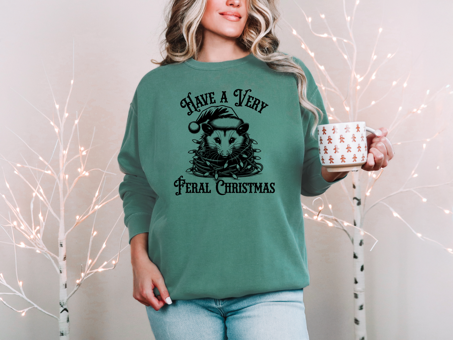 a woman in a green sweatshirt holding a mug
