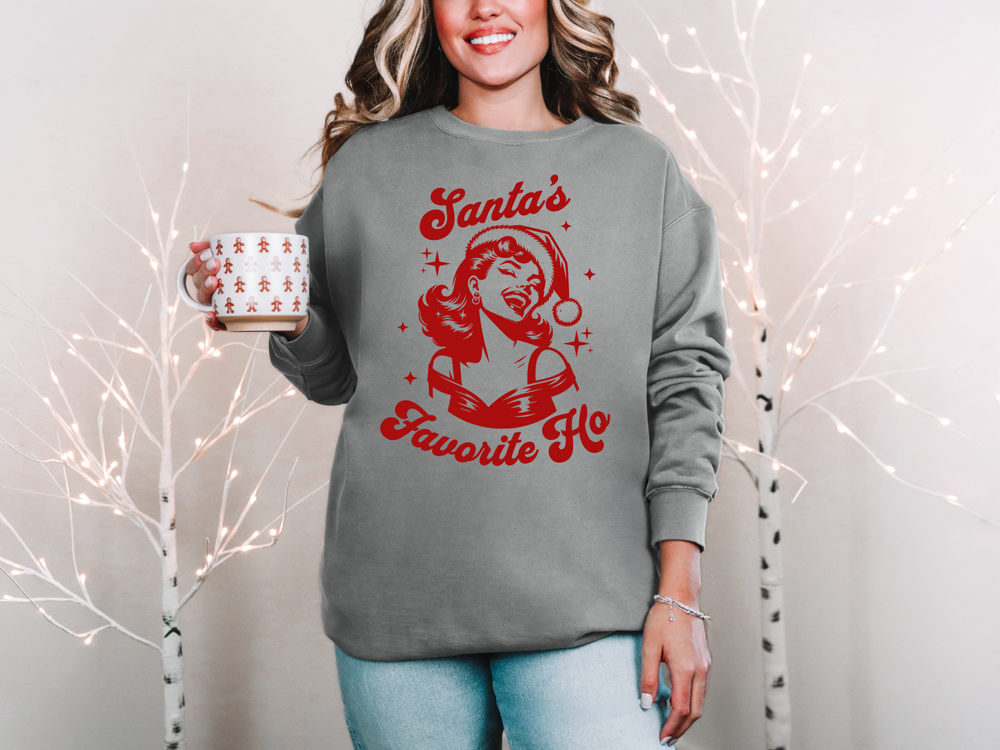 a woman wearing a santa's favorite coffee sweatshirt