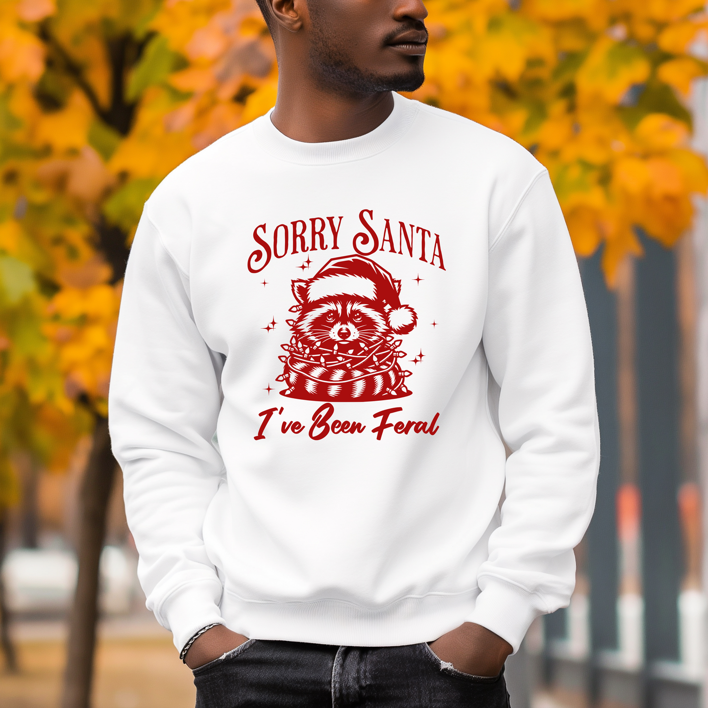 a man wearing a white sweatshirt with a raccoon on it