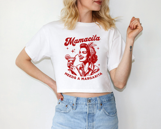 a woman wearing a white shirt with a picture of a woman holding a microphone