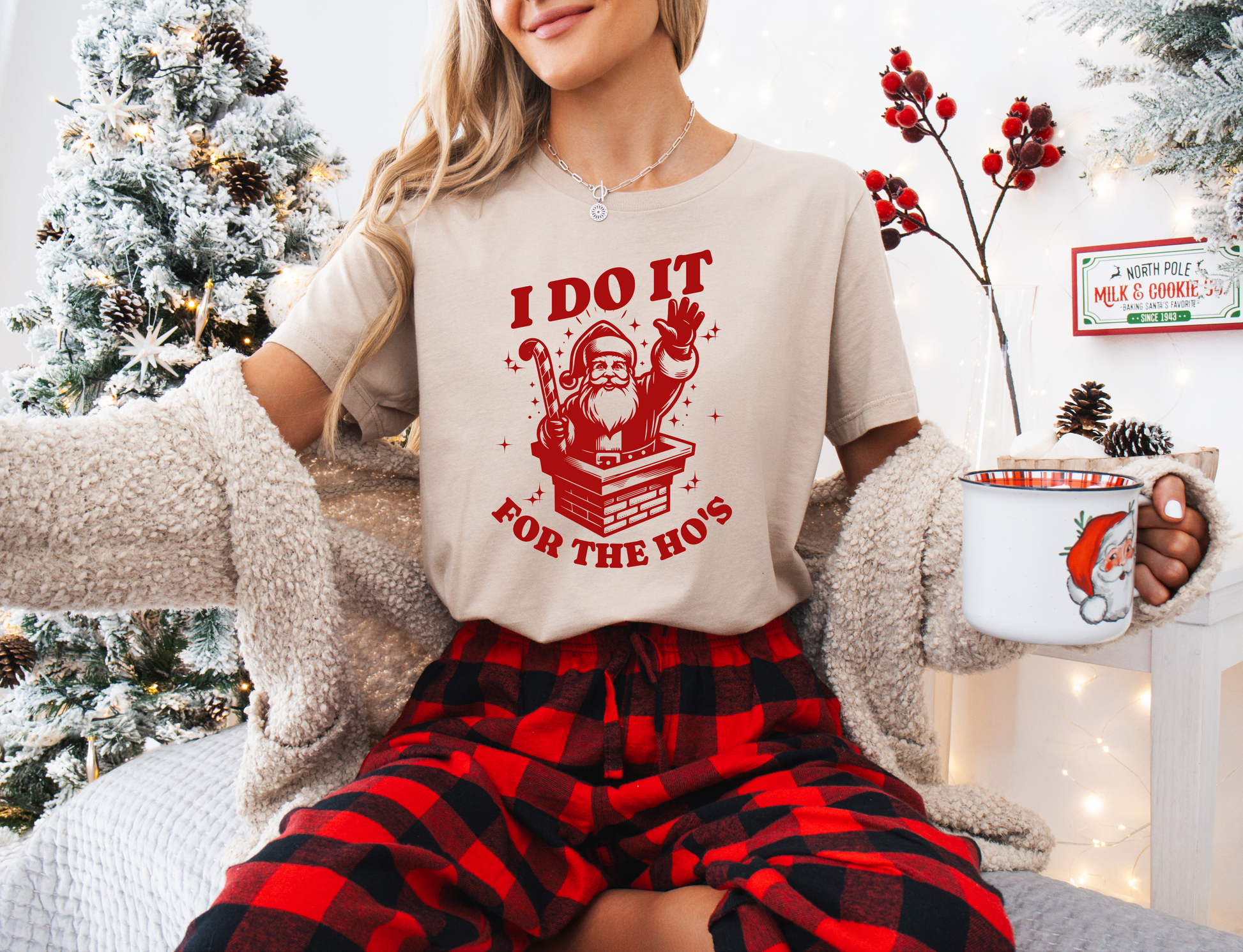 a woman sitting on a bed wearing a t - shirt that says i do it