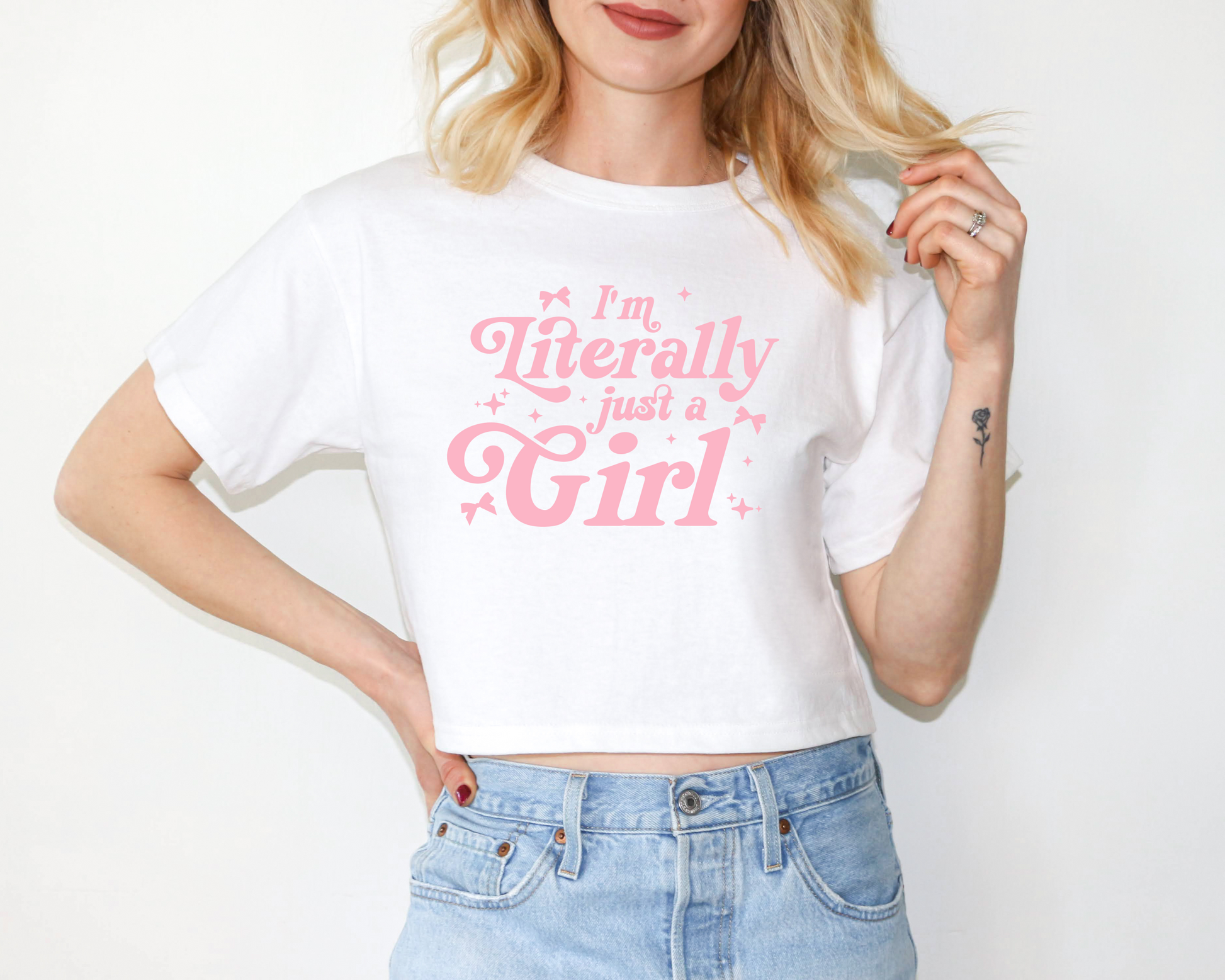 a woman wearing a white t - shirt that says i'm literally just a
