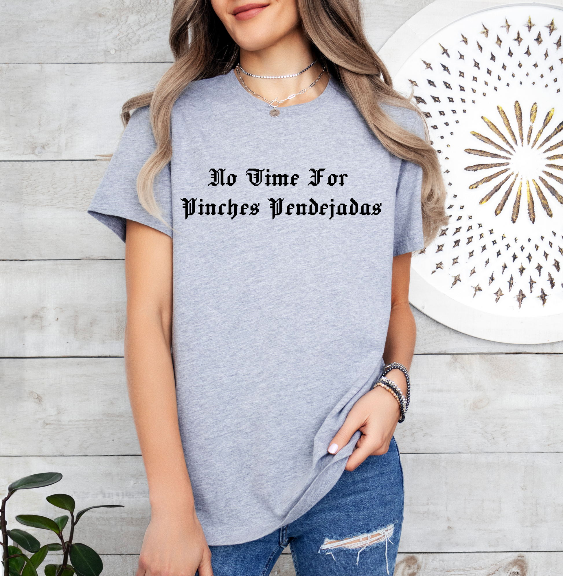 a woman wearing a t - shirt that says no wine for unicorns vending