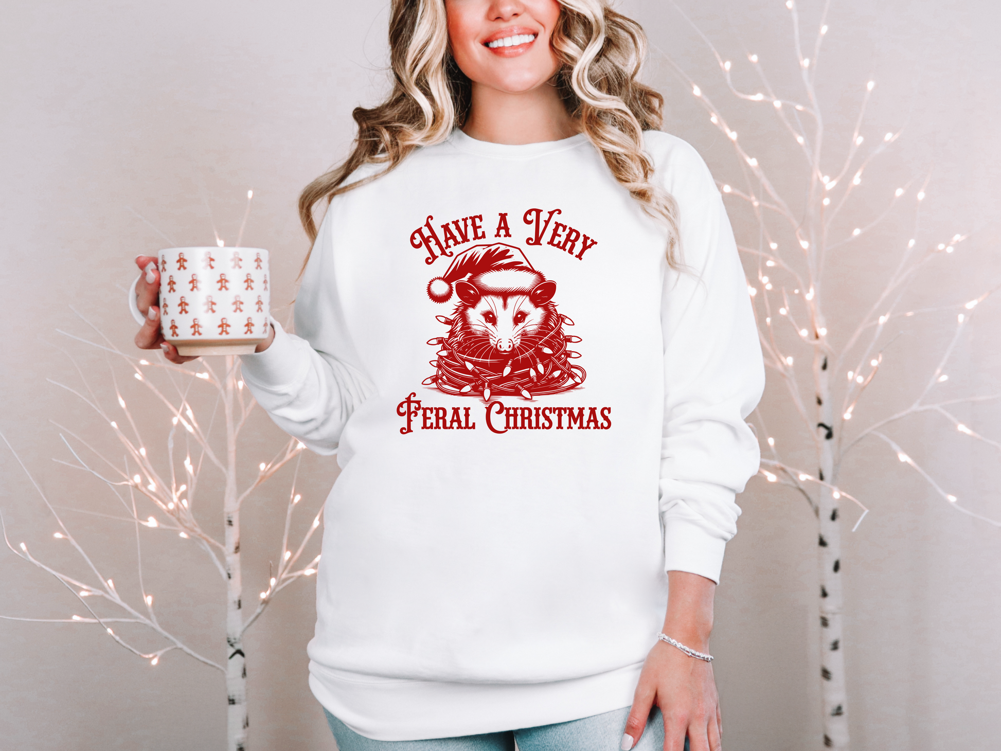 a woman holding a coffee mug and a christmas sweater