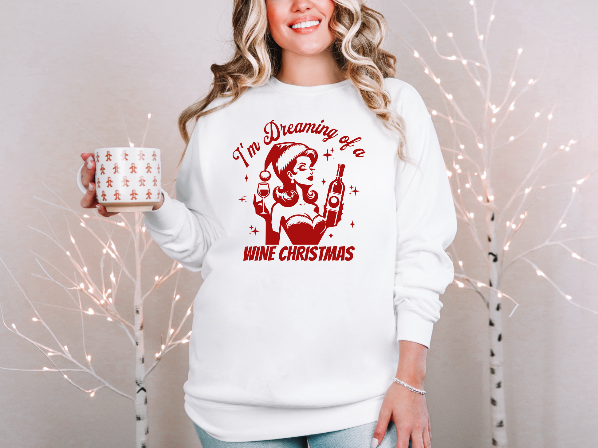 a woman in a white sweatshirt holding a coffee mug