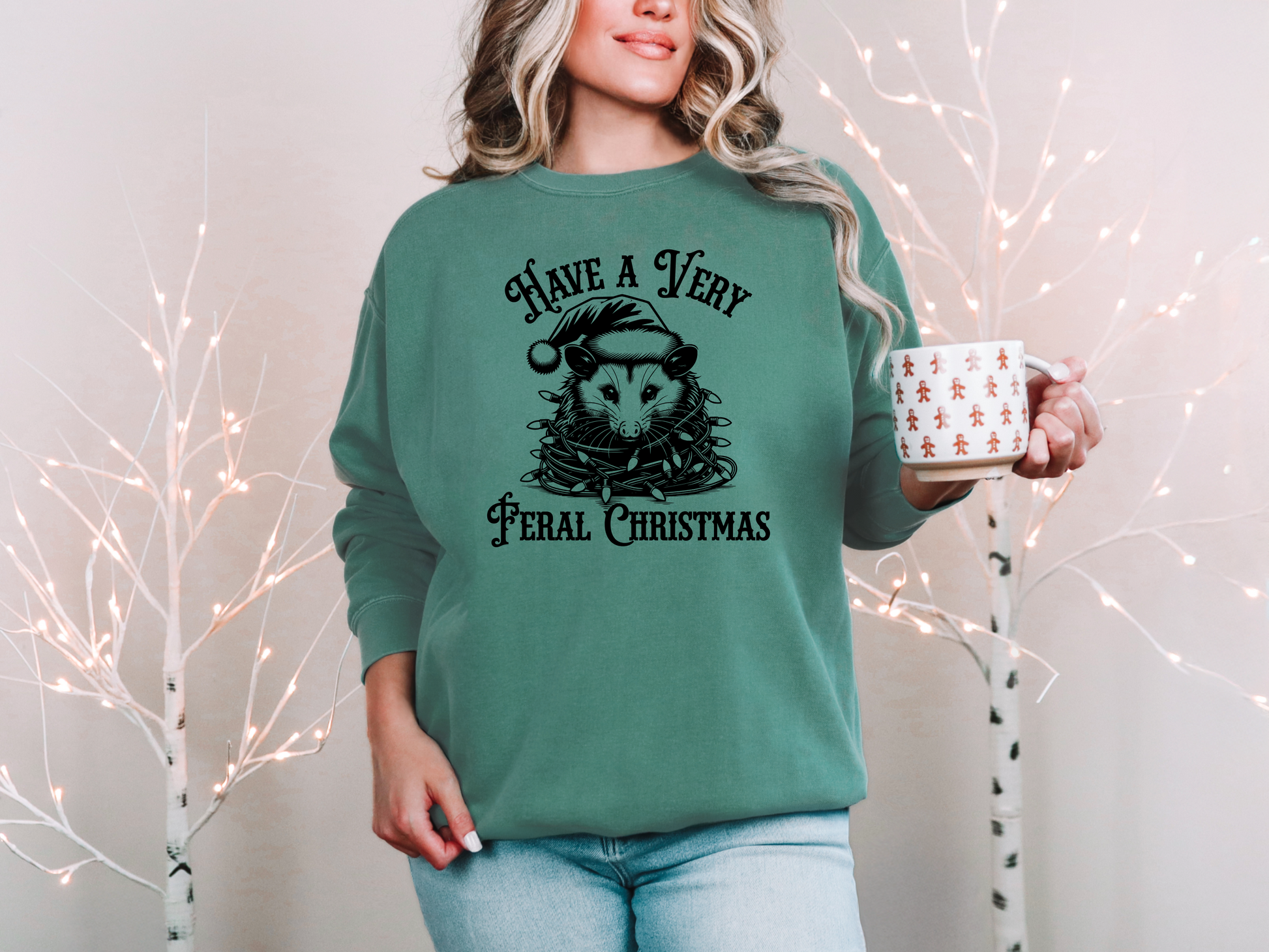 a woman in a green sweatshirt holding a mug