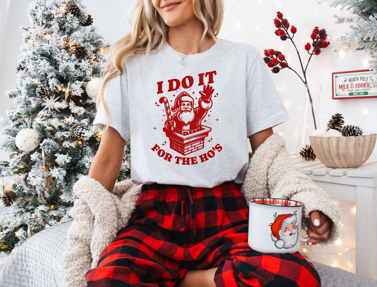 a woman sitting on a bed holding a mug