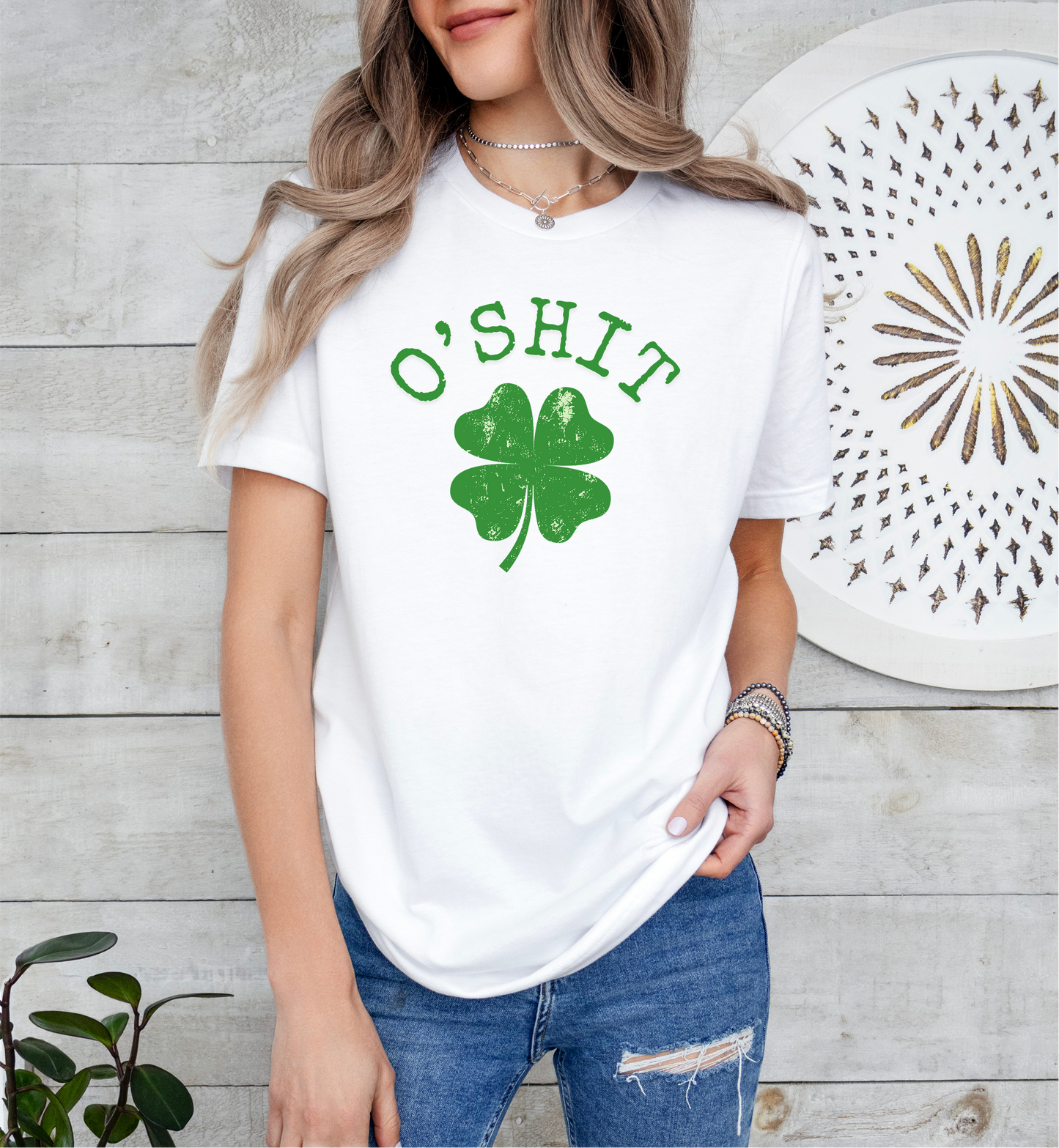 a woman wearing a t - shirt with a shamrock on it